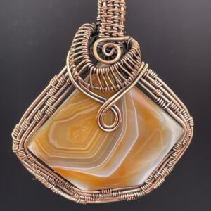 Hand Wrapped Copper Wire Solar Agate in Burnt Orange Pendant 1 scaled - Hand Wrapped Copper Wire Solar Agate in Burnt Orange Pendant, 1 - Hand Wrapped Copper Wire Solar Agate in Burnt Orange Pendant, 1 - AURORA ARTISAN JEWELLERY