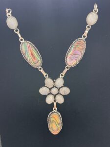 Beautiful iridescent abalone shell and rainbow moonstone with a captivating blue flash set in a handmade silver plated necklace.