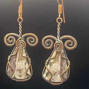 Crazy lace agate with intricate swirling patterns in hand-wrapped copper wire earrings