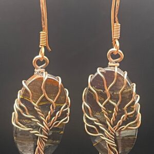 Hand-wrapped copper wire tree of life earrings featuring iron tiger's eye with striking, layers that blend metallic shimmers with earthy tones.