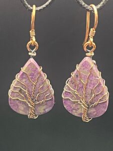 Pretty purpurite jasper set within hand-wrapped copper wire tree of life earrings.