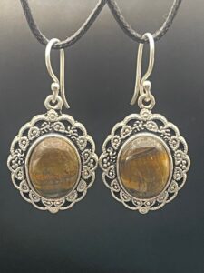 Shimmering Tiger's Eye in rich honey and chocolate brown tones set within decorative handmade silver plated drop earrings with hooks